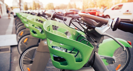 Number of bicycles are on parking for rent by tourists contactless payment