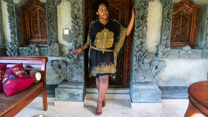 African american black woman posing in front of door