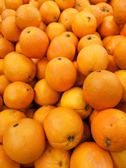 Ripe tangerines in a store window