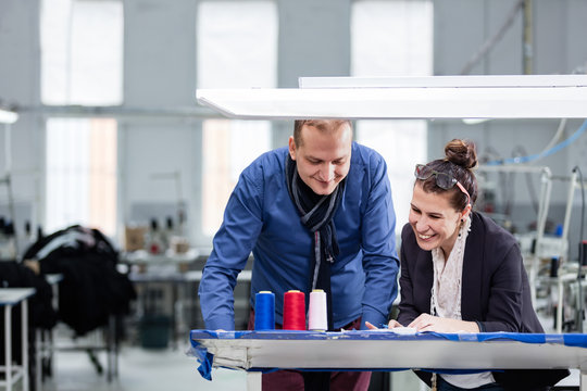 Small Business Owner And Adult Woman Working In Factory.