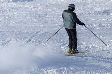 Fototapeta na wymiar Man skiing in the snow in winter