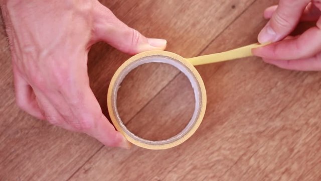 Boobin of adhesive tape on the floor