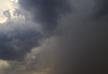 Clouds after rain before sunset as a background