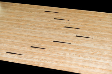 Parquet wood floor black arrows of bowling sport