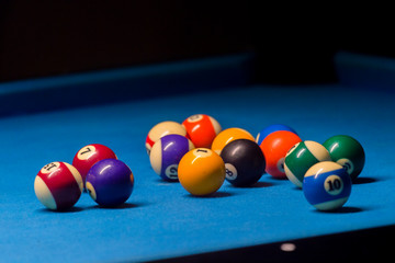 Colorful billiards balls. Billiard ball at blue table. Colorful