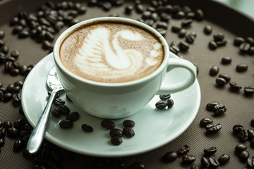 Coffee cup and coffee, coffee beans on the table
