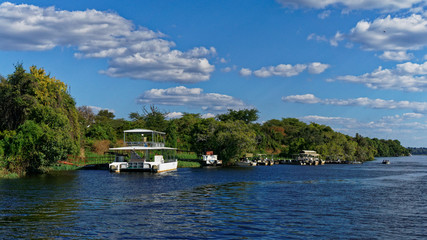 Tourist river cruise boats, Zambezi river, Chobe National Park, Botswana.