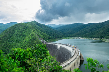 The Big Concrete Dam Between Mountains with Green Forest