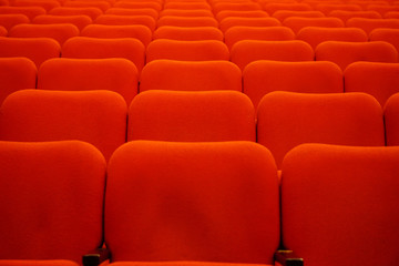 Red theater seats in a row