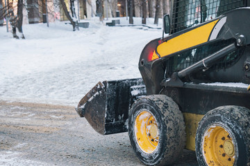 snow cleaning machine work hard in city streets b