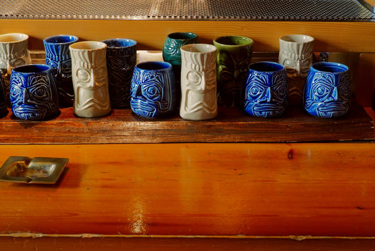 Ceramic cocktail mugs on wooden table