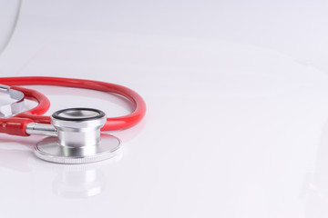 Stethoscope On White Background with selective focus and crop fragment