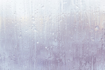 Naklejka na ściany i meble Frozen window in winter with drops and drips