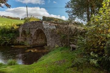 Stone bridge over Badgworthy Water in Malmsmead, Devon, England, UK