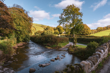 Crossing Badgworthy Water in Malmsmead, Devon, England, UK