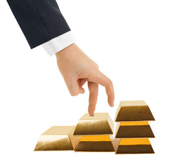 Hand and stairs made of gold bars