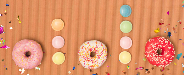 colorful brown carnival background with donuts and other funny items