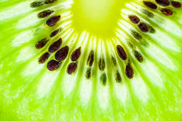 Fresh kiwi fruit slices closeup macro texture background
