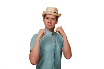 The man in a shirt and a hat keeps hands in a boxing rack