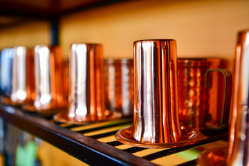 Cup and jug made of copper for water, tea, coffee or wine.