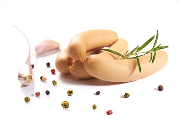 Sausage with herbs and spices on a white background - obrazy, fototapety, plakaty