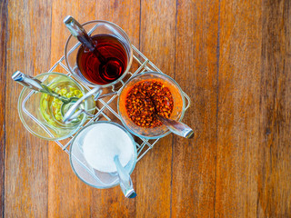 Garnish noodles seasoning Thai style on wood table- sugar, dried.