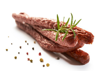 Sausage with herbs and spices on a white background