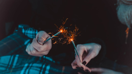Bengal fire sticks, sparkling, burning, lovers hands fire