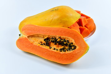 Slices of papaya on white background.