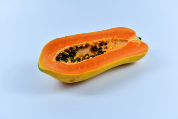 Slices of papaya on white background.