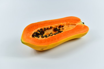 Slices of papaya on white background.