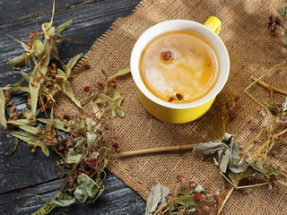 Herbal tea. Picking out a strawberry and lime blossom. Alternative medicine