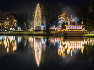 Night on Lake Bled. Christmas atmosphere and lights. Castle and Church of the Annunciation
