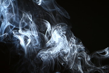 Fototapeta premium lovely abstract glowing bright smoke against black background.