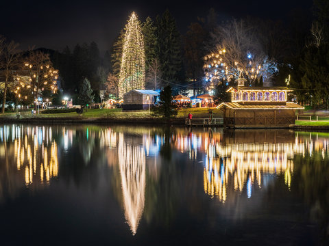 Night on Lake Bled. Christmas atmosphere and lights. Castle and Church of the Annunciation