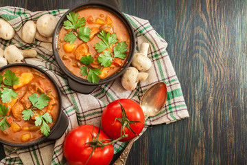 Stew soup with meat, potatoes, mushrooms and red pepper