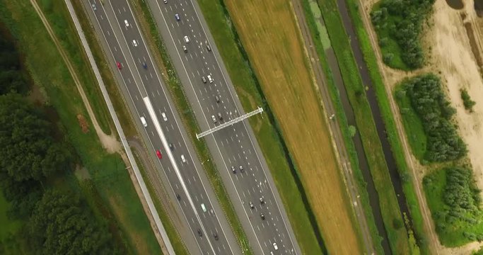 Cars on high way from above in typical Dutch landscape