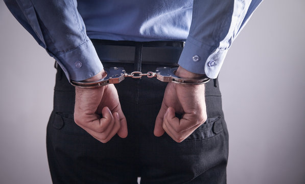 Businessman in handcuffs. Business Crime