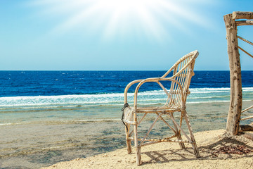 Stylishly beautiful chair on the sea nature landscape background