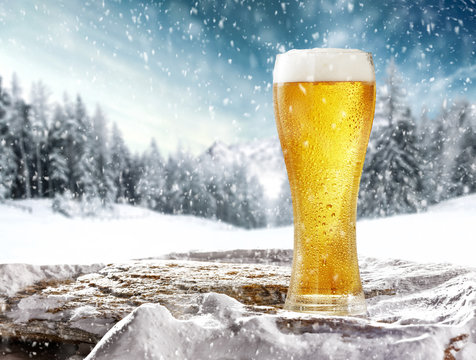 Winter beer on stone and snow decoration 