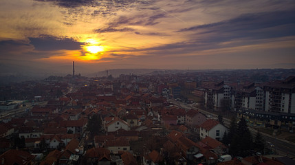 Aerial view of sunset in Kragujevac town in Serbia, cloudy winter day