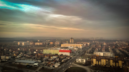 Fototapeta na wymiar Aerial view of sunset in Kragujevac town in Serbia, cloudy winter day