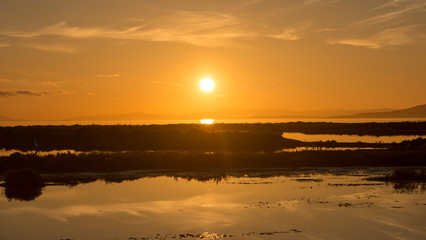 Naklejka premium Panoramic of a sunset in the ebro delta by the sea