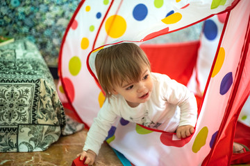 little girl play in a wigwam tent