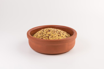 bowl of raw bulgur and quinoa isolated on white background