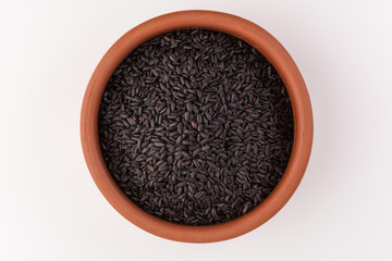 bowl of black wild rice on wooden table background