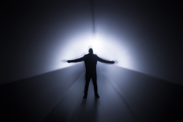 Obraz na płótnie Canvas futuristic silhouette of man in a tunnel 