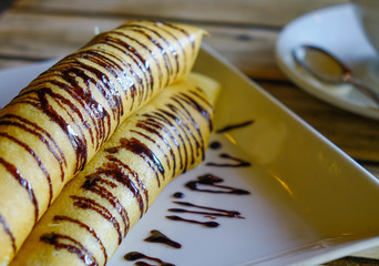 Delicious pancakes with chocolate sauce