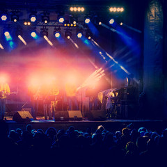 rock band music concert in the alfresco evening and fans. Concert Crowd. Rock music.