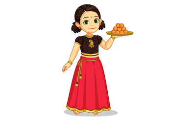 Cute little girl in traditional wear holding a plate of sweets